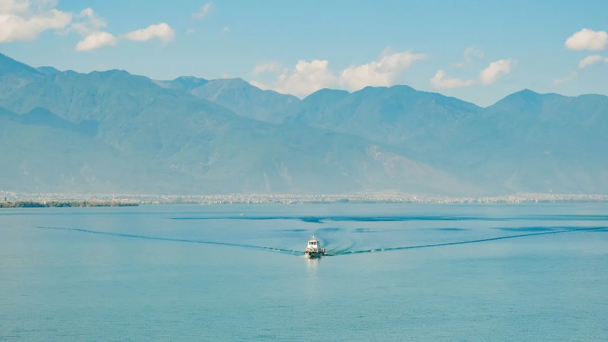 A boat on Erhai Lake with the Cangshan mountains in Dali