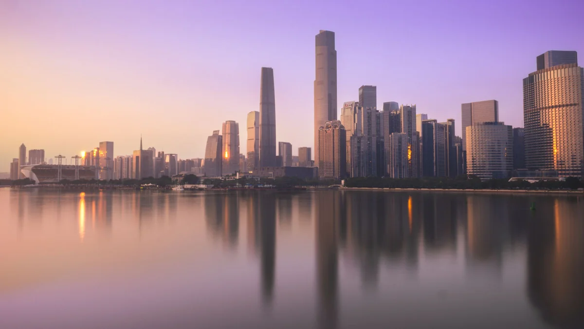 Zhujiang New Town twin towers at dusk, reflected in the Pearl River in Guangzhou
