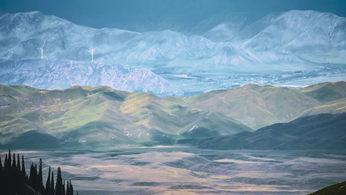 Misty Tianshan foothills and spruce trees near Urumqi