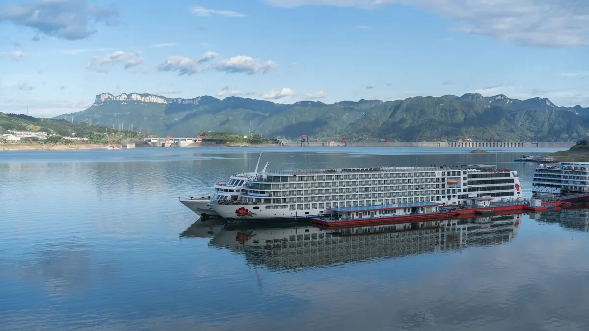 Cruise ships on the Yangtze near the Three Gorges Dam and green hills in Yichang